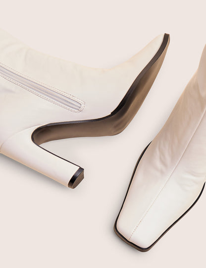 Acquilla White Knee High Flared Boots